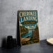 A vintage-style metal sign for Cherokee Landing State Park in Oklahoma, featuring a scenic image of the lake and surrounding landscape.