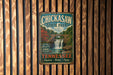 A vintage metal sign for Chickasaw State Park in Tennessee, featuring a scenic image of a waterfall surrounded by lush greenery.