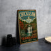 A vintage-style metal sign for Chickasaw State Park in Tennessee, featuring a scenic illustration of a waterfall and a bridge.