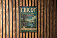 A vintage-style metal sign for Chicot State Park in Louisiana, featuring a bird and a lush, tropical landscape.