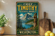 A vintage-style sign for Chief Timothy State Park in Washington, featuring a mountain landscape and a wooden carving of a Native American figure.