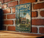 A vintage-style metal sign for Chipokes Plantation State Park in Virginia, featuring an illustration of a historic building surrounded by trees.