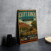 A vintage-style metal sign for Cluff Ranch State Park in Arizona, featuring a scenic illustration of the park's landscape.