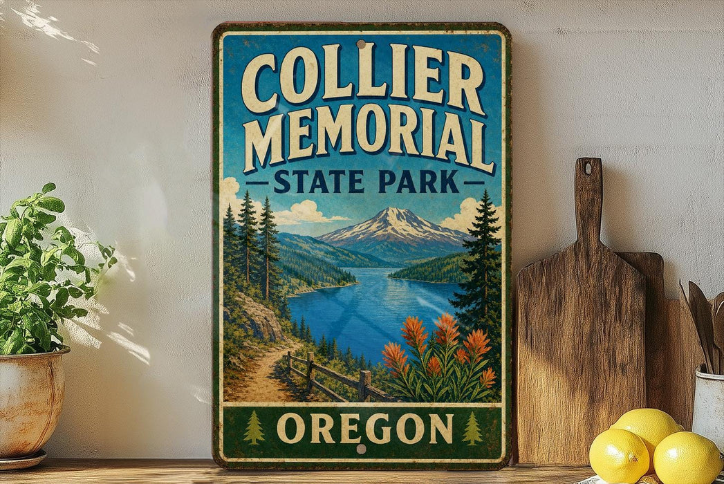 A vintage-style metal sign for Collier Memorial State Park in Oregon, featuring a scenic landscape with mountains, a lake, and a path leading through the forest.