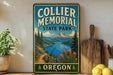 A vintage-style metal sign for Collier Memorial State Park in Oregon, featuring a scenic landscape with mountains, a lake, and a path leading through the forest.