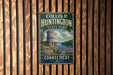 A vintage metal sign for Collis P. Huntington State Park in Connecticut, featuring a castle and a scenic landscape.