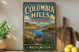 A vintage-style sign for Columbia Hills State Park in Washington, featuring a scenic landscape with mountains, a river, and flowers.