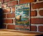 A vintage-style metal sign for the Conestoga State Recreation Area in Nebraska, featuring a wagon on a grassy field with a river in the background.