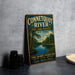 A vintage-style sign for the Connecticut River State Park, featuring a scenic illustration of the river surrounded by trees and a cloudy sky.