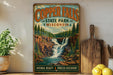 A vintage-style sign for Copper Falls State Park in Wisconsin, featuring a scenic illustration of a waterfall surrounded by pine trees and rocky cliffs.