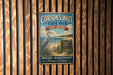 A vintage metal sign for Corson's Inlet State Park in New Jersey, featuring a seagull and a beach scene.