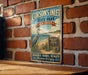 A vintage metal sign for Corson's Inlet State Park in New Jersey, featuring a seagull and beach scenery.