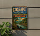 A vintage metal sign for the Cossatot River State Park in Arkansas, featuring a scenic landscape with a river, trees, and mountains.