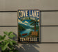 A vintage-style metal sign for Cove Lake State Park in Tennessee, featuring a scenic landscape with a lake, mountains, and a canoe.