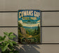 a vintage-style sign for Cowans Gap State Park in Pennsylvania, with a scenic landscape of mountains, trees, and a winding path.