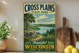 A vintage-style sign for Cross Plains State Park in Wisconsin, featuring a scenic landscape with a lake and mountains.