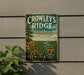 A vintage metal sign for Crowley's Ridge State Park in Arkansas, featuring a scenic landscape with a river and mountains.