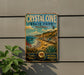 A vintage-style metal sign for Crystal Cove State Park, California, featuring a scenic beach landscape with palm trees and other natural elements.