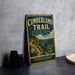 A vintage-style metal sign for the Cumberland Trail in Tennessee, featuring a scenic mountain landscape and trail map.