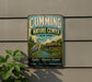 a vintage metal sign for the Cumming Nature Center in New York, with a large bird illustration and text promoting nature, education, and conservation.