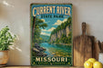 A vintage-style sign for Current River State Park in Missouri, featuring a scenic landscape with a river, cliffs, and trees.