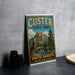 A vintage-style sign for Custer State Park in South Dakota, featuring a mountain landscape and a ram.