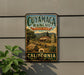A vintage-style metal sign for Cuiyama Ranch State Park in California, featuring a scenic illustration of the park and its surroundings.
