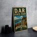 A vintage-style sign for D.A.R. State Park in Vermont, featuring a scenic landscape with mountains, trees, and a lake.
