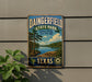 A vintage metal sign for Dainingfield State Park in Texas, featuring a scenic landscape with a lake and trees.