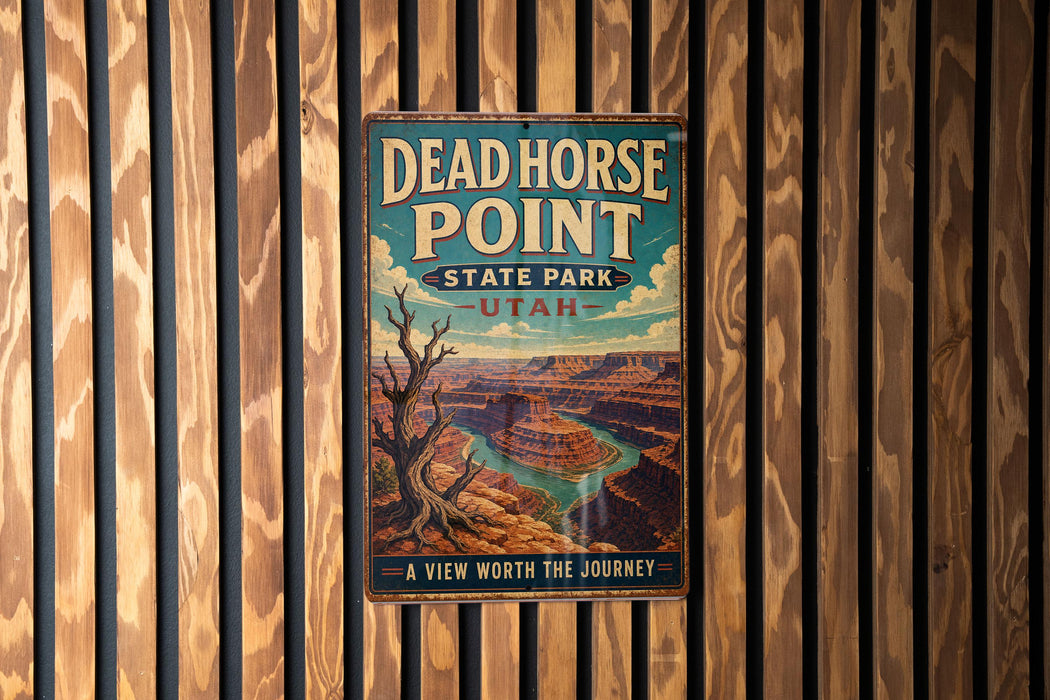 A vintage metal sign for Dead Horse Point State Park in Utah, featuring a scenic illustration of the Grand Canyon.