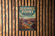 A vintage metal sign for Dead Horse Point State Park in Utah, featuring a scenic illustration of the Grand Canyon.