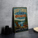 A vintage-style metal sign for Deep Creek Lake State Park in Maryland, featuring a scenic image of a lake, mountains, and a canoe.