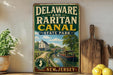 A vintage-style sign for Delaware and Raritan Canal State Park, featuring a scenic illustration of a canal with a houseboat and bridge.