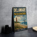 A vintage metal sign for Delaware Shore State Park, featuring a lighthouse and beach scene, is displayed on a countertop next to some black camera lenses.