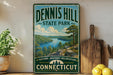 A vintage-style sign for Dennis Hill State Park in Connecticut, featuring a scenic landscape with a lake and mountains.