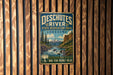 A vintage-style metal sign for the Deschutes River State Recreation Area in Oregon, featuring a scenic landscape with a river, mountains, and pine trees.