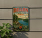 A vintage metal sign for Dillon State Park in Ohio, featuring a scenic landscape with a river and trees.
