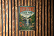 A vintage metal sign for Dixon Springs State Park in Illinois, featuring a waterfall and lush greenery.