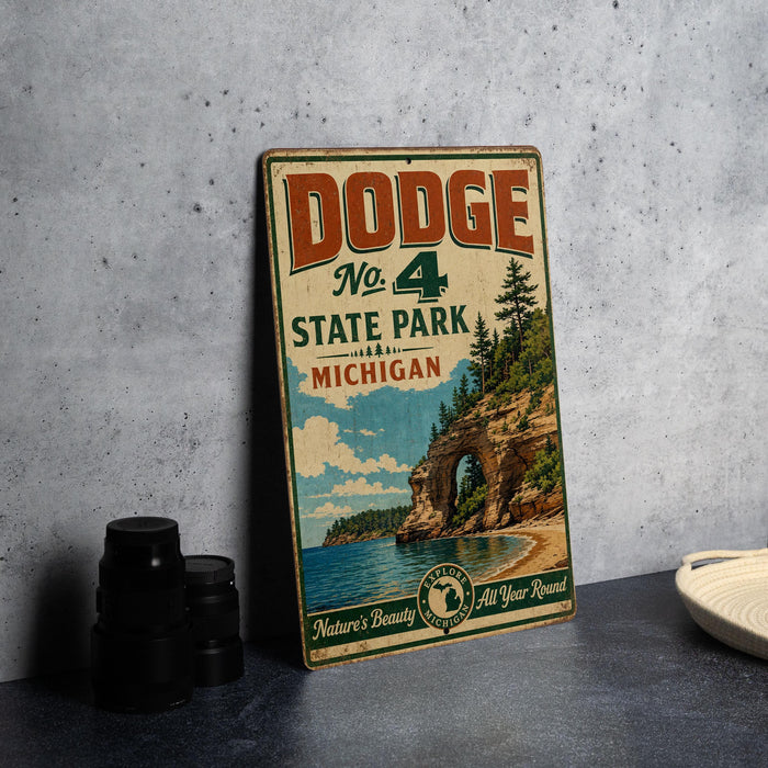 A vintage Dodge sign advertising Dodge No. 4 State Park in Michigan, featuring a scenic image of the park and its surrounding landscape.