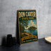 A vintage-style metal sign for Don Carter State Park in Georgia, featuring a scenic landscape with pine trees, a lake, and mountains.
