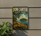 A vintage-style metal sign for Don Carter State Park in Georgia, featuring a scenic landscape with a lake and trees.