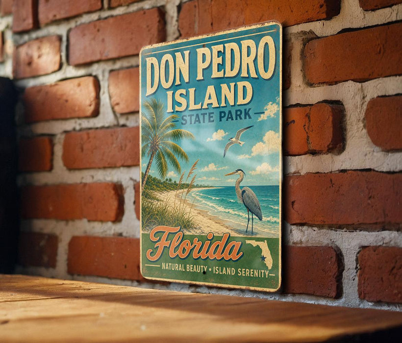 A vintage-style sign for Don Pedro Island, Florida, featuring a beach scene with palm trees, a crane, and a seagull.