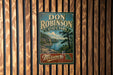 A vintage-style metal sign for Don Robinson State Park in Missouri, featuring a scenic landscape with a lake and mountains.
