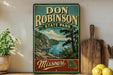 A vintage-style sign for Don Robinson State Park in Missouri, featuring a scenic landscape with a lake and mountains.