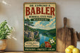 a vintage-style metal sign for Dr. Edmund A. Babler Memorial State Park in Missouri, with a scenic landscape of a river and mountains in the background.