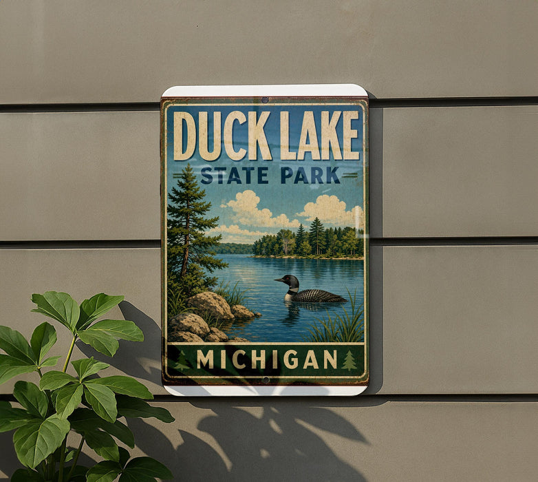 A vintage-style metal sign for Duck Lake State Park in Michigan, featuring a scenic image of a lake with a duck swimming in the foreground.