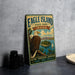A vintage-style metal sign for Eagle Island State Park in Idaho, featuring an illustration of a bald eagle perched on a tree branch overlooking a scenic lake and mountains.