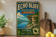 A vintage-style sign for Echo Bluff State Park in Missouri, featuring a scenic landscape with a lake and cliffs, is displayed on a shelf next to a wooden cutting board and some lemons.