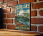 A vintage-style metal sign for Echo Lake State Park in New Hampshire, featuring a scenic image of a lake with a canoe and mountains in the background.