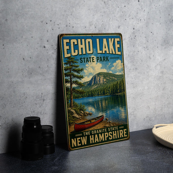 A vintage-style metal sign for Echo Lake State Park in New Hampshire, featuring a scenic image of a lake, mountains, and a red canoe.